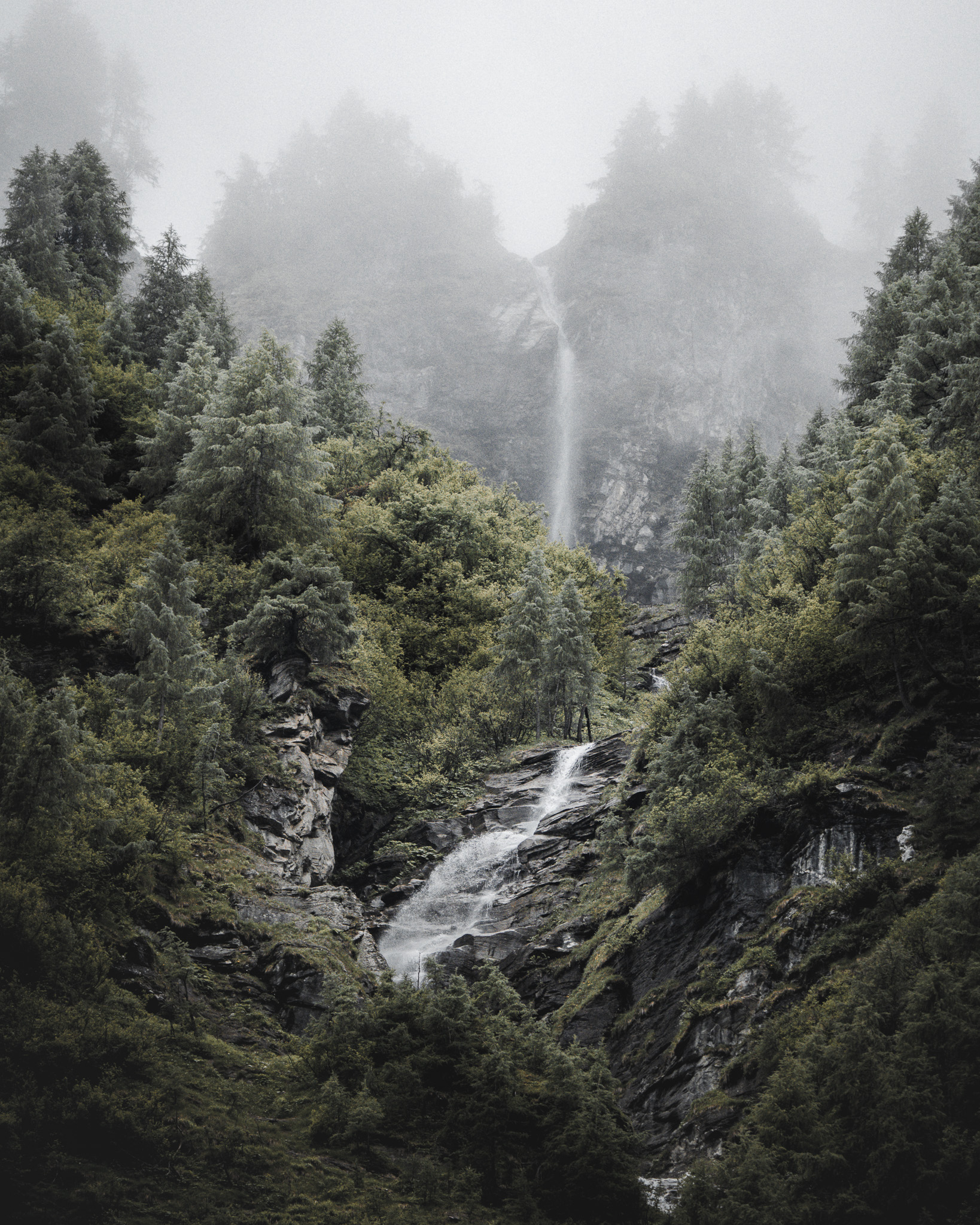 Dramatic mountain landscape with layered ridges and atmospheric light
